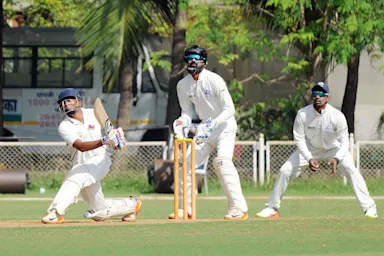Siraj four-for skittles out Karnataka for 183